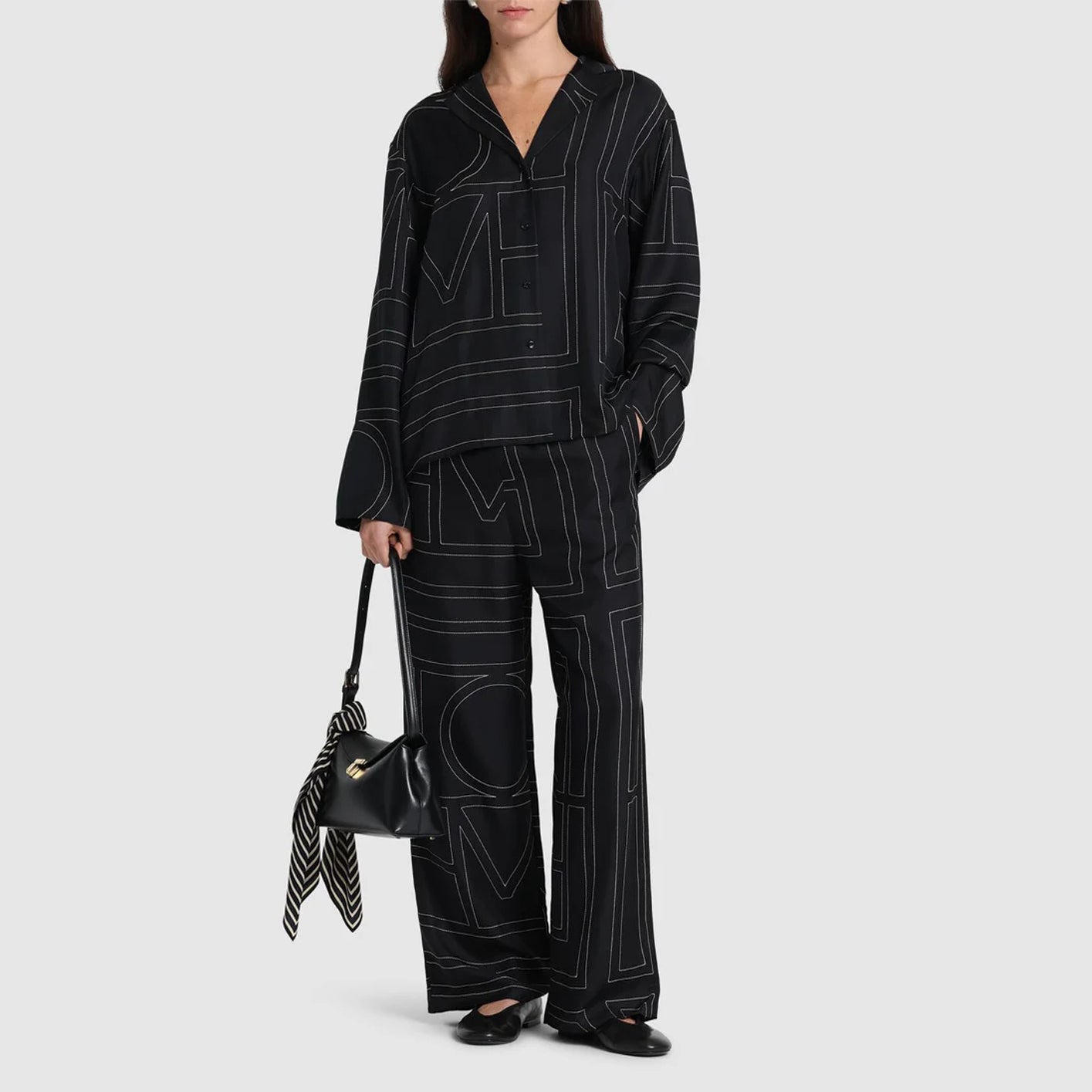 Monogram embroidered black silk pants