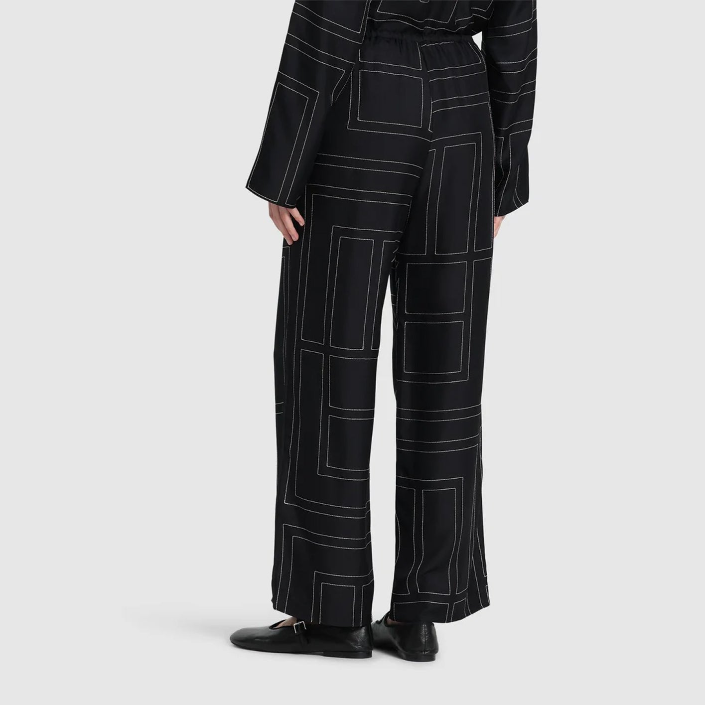 Monogram embroidered black silk pants